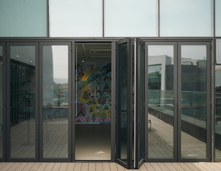 Aluminium bifold doors folded back to open a room onto the garden