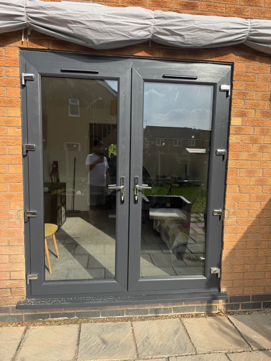 Anthracite grey French doors with chrome handles, fitted by URG